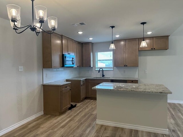 kitchen featuring hanging light fixtures and a kitchen island