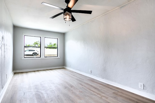1016 N Campus Blvd, San Angelo, TX 76901 - unfurnished room featuring wood finished floors, a ceiling fan, and baseboards