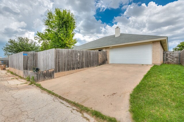 view of property exterior featuring a garage