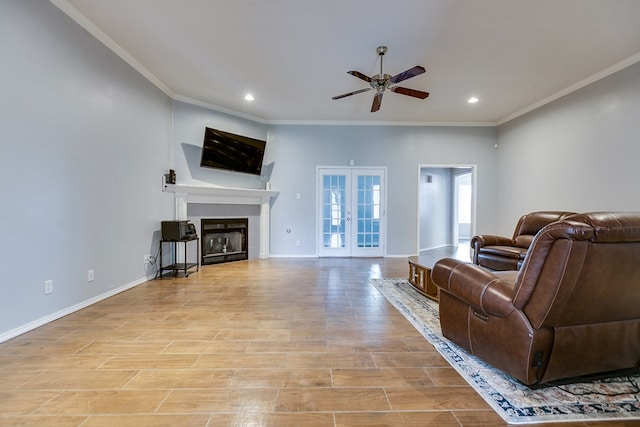 living room featuring crown molding, ceiling fan, and french doors