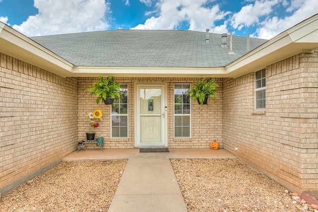 doorway to property featuring a patio area