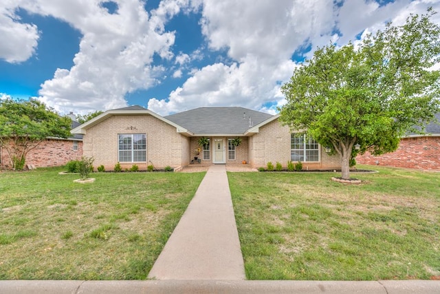 ranch-style home with a front lawn