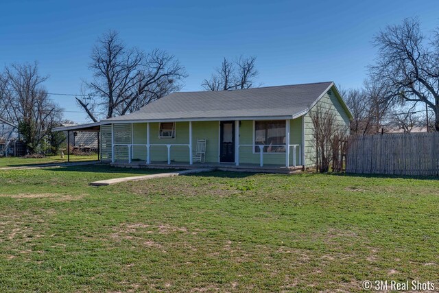 view of front of property with a front yard and covered porch