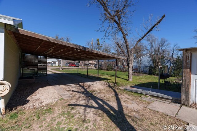 view of yard with a carport