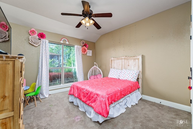 carpeted bedroom with lofted ceiling, multiple windows, and ceiling fan