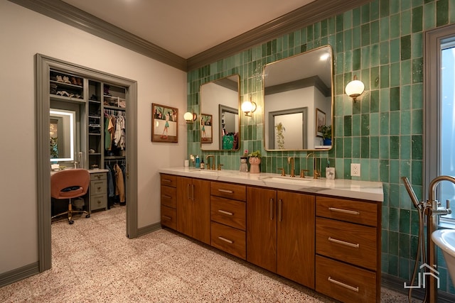 bathroom with crown molding, tile walls, and vanity