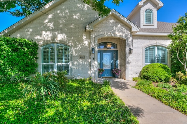 property entrance with brick siding