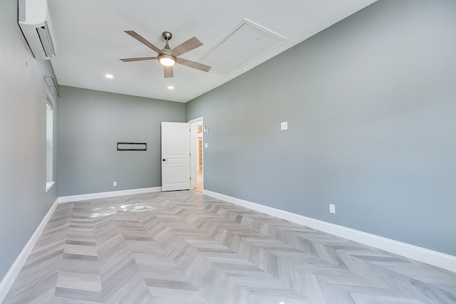 unfurnished room featuring a ceiling fan, attic access, a wall mounted AC, baseboards, and recessed lighting