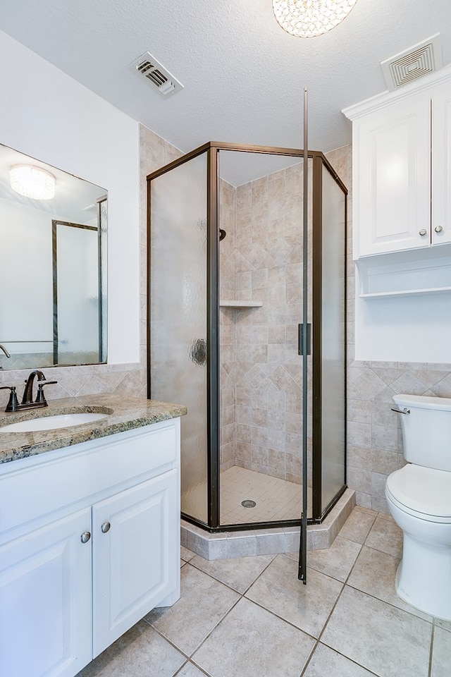 full bathroom featuring visible vents, tile patterned flooring, and a stall shower