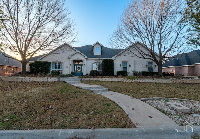 view of front of house with a lawn