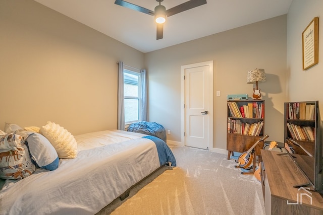bedroom featuring ceiling fan, baseboards, and carpet floors