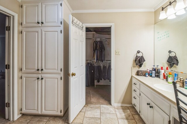 bathroom featuring vanity and ornamental molding