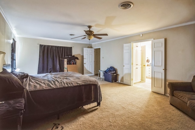 bedroom with ornamental molding, light colored carpet, and ceiling fan