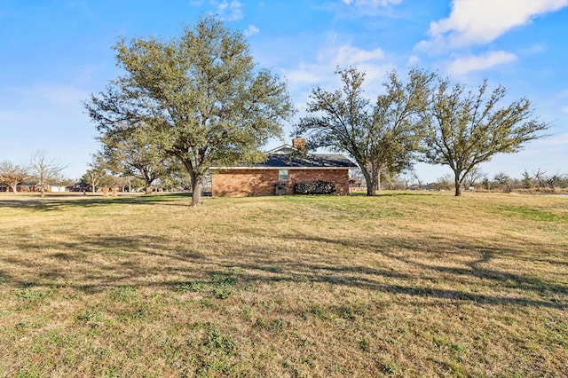 view of yard with a rural view