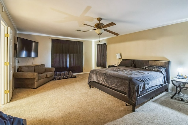 bedroom featuring crown molding, light colored carpet, and ceiling fan