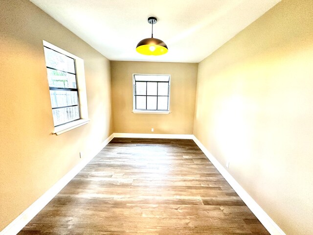 empty room with light hardwood / wood-style floors