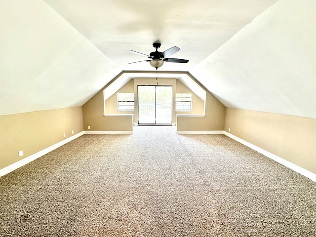 bonus room featuring ceiling fan, lofted ceiling, and carpet floors