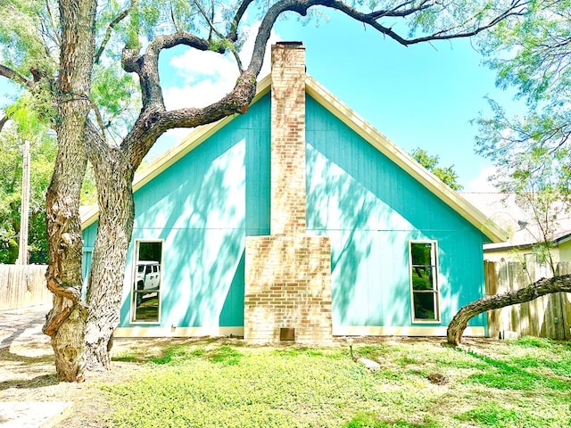 view of side of property with a yard