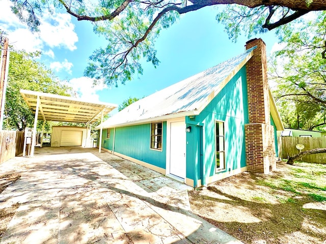 view of home's exterior with a carport