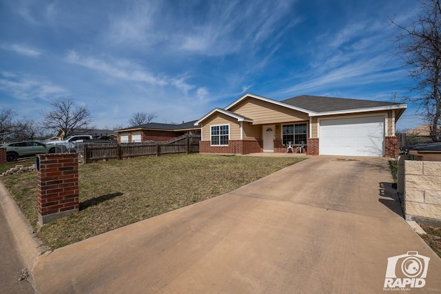 view of front facade with a front yard, fence, driveway, a garage, and brick siding