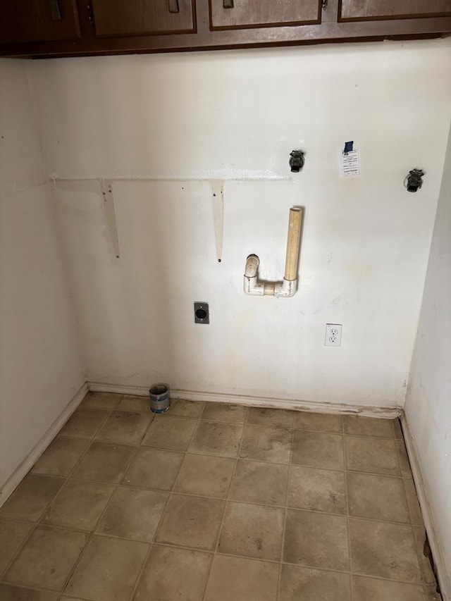 7646 Violet St, San Angelo, TX 76901 - washroom featuring cabinet space, electric dryer hookup, and baseboards