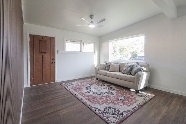 living room featuring vaulted ceiling, ceiling fan, and dark hardwood / wood-style flooring