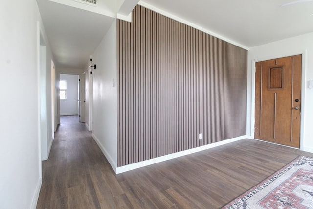 hall featuring dark hardwood / wood-style floors and a barn door