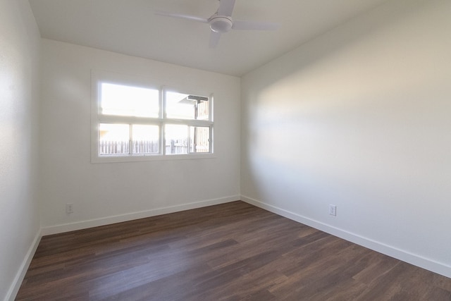 spare room with ceiling fan, lofted ceiling, and dark hardwood / wood-style floors