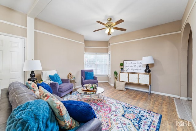 901 Koberlin St, San Angelo, TX 76903 - living area with a ceiling fan, wood finished floors, baseboards, and arched walkways