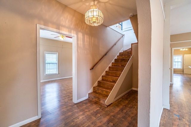 stairway with wood-type flooring, ceiling fan, and plenty of natural light