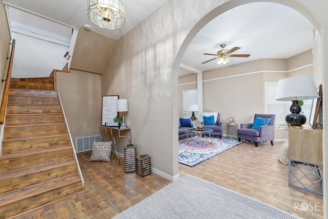 901 Koberlin St, San Angelo, TX 76903 - stairway with arched walkways, a ceiling fan, wood finished floors, and baseboards