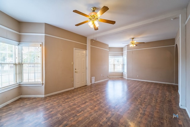 unfurnished room with dark hardwood / wood-style flooring and ceiling fan