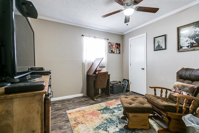 sitting room featuring crown molding, dark hardwood / wood-style floors, ceiling fan, and a textured ceiling