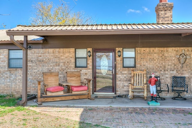 entrance to property with a patio area