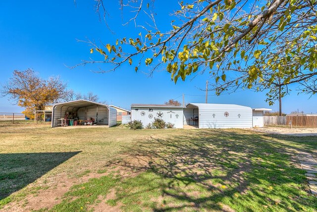 view of yard with a carport