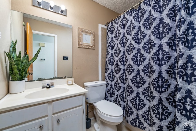 bathroom featuring a textured ceiling, a textured wall, curtained shower, toilet, and vanity