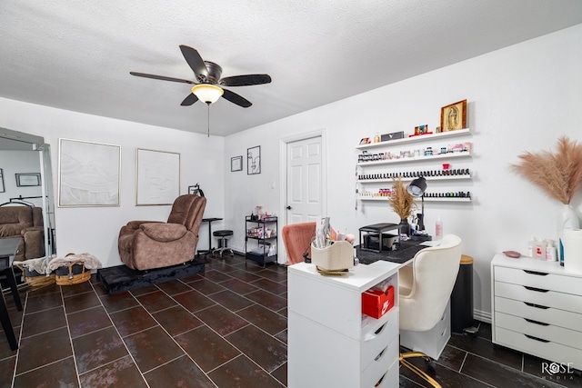 office space with ceiling fan and a textured ceiling