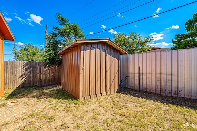 view of shed featuring a fenced backyard