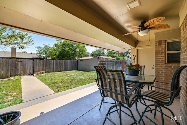 1729 Parkview Dr, San Angelo, TX 76904 - fenced backyard with a patio area, a shed, a ceiling fan, outdoor dining space, and a gate