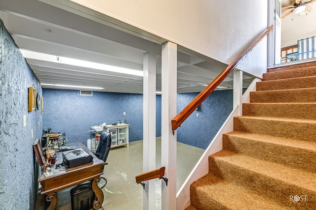 1729 Parkview Dr, San Angelo, TX 76904 - staircase with concrete floors and a textured wall