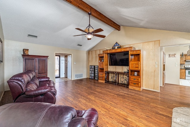 1729 Parkview Dr, San Angelo, TX 76904 - living area featuring wood finished floors, a ceiling fan, and a textured ceiling