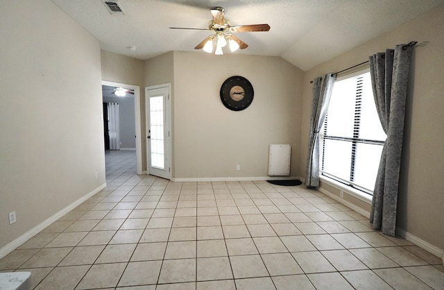 710 Penhurst Ct, San Angelo, TX 76901 - unfurnished room featuring a ceiling fan, plenty of natural light, baseboards, lofted ceiling, and light tile patterned flooring