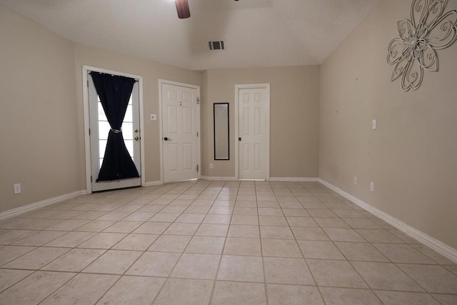 710 Penhurst Ct, San Angelo, TX 76901 - unfurnished room with a ceiling fan, light tile patterned floors, and baseboards