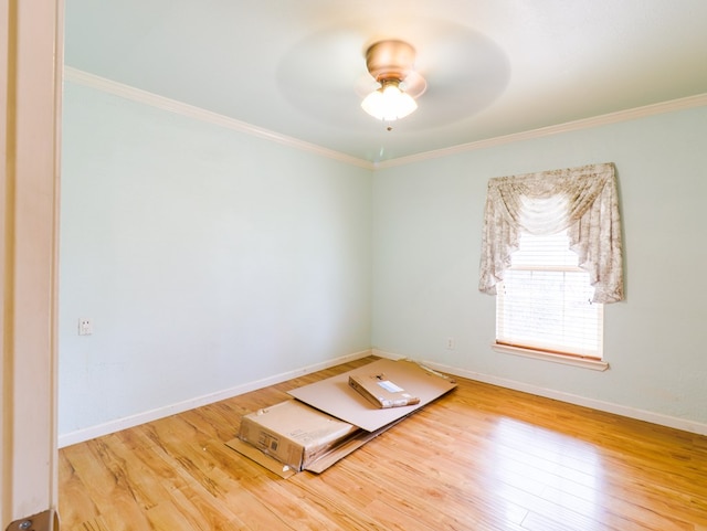 spare room with ornamental molding, hardwood / wood-style floors, and ceiling fan