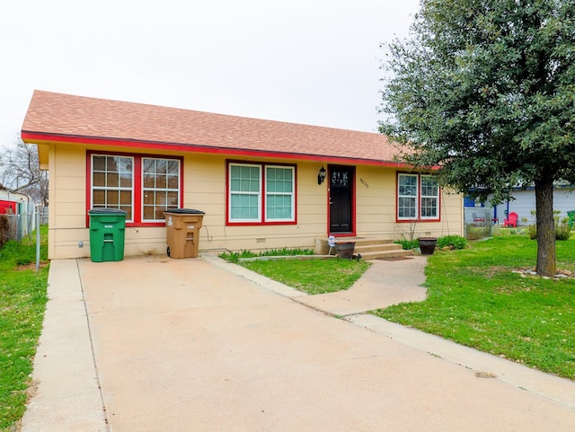 ranch-style home with a front yard