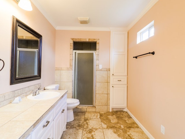 bathroom featuring tile walls, an enclosed shower, vanity, ornamental molding, and toilet