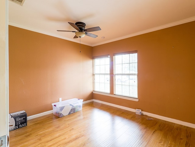 unfurnished room with crown molding, ceiling fan, and light hardwood / wood-style flooring