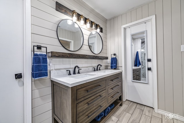 3610 Southland Blvd, San Angelo, TX 76904 - bathroom with double vanity and wooden walls