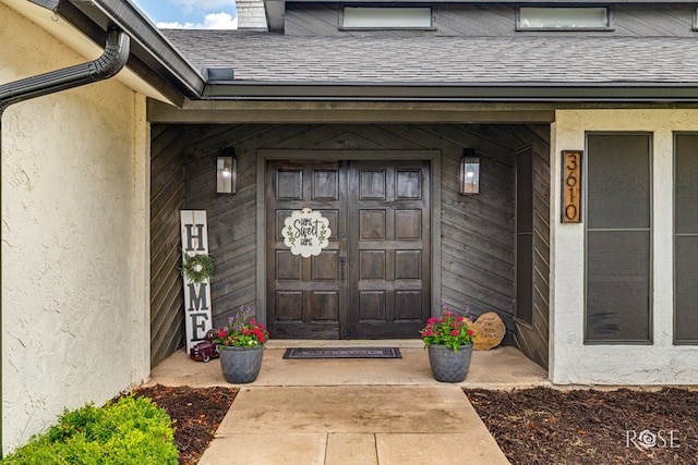 3610 Southland Blvd, San Angelo, TX 76904 - property entrance featuring roof with shingles and stucco siding