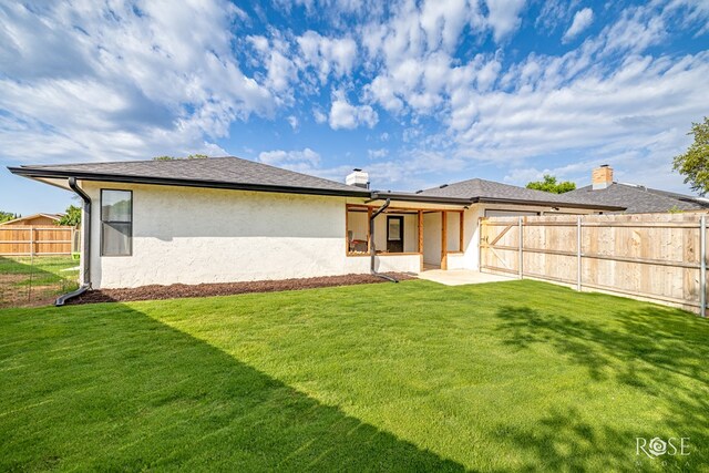 3610 Southland Blvd, San Angelo, TX 76904 - back of house featuring stucco siding, a patio area, and a chimney